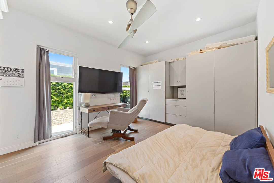 29500 Heathercliff Road, Unit 184 Malibu, CA 90265 - Photo 20 of 46 a bedroom with a bed tv and chair