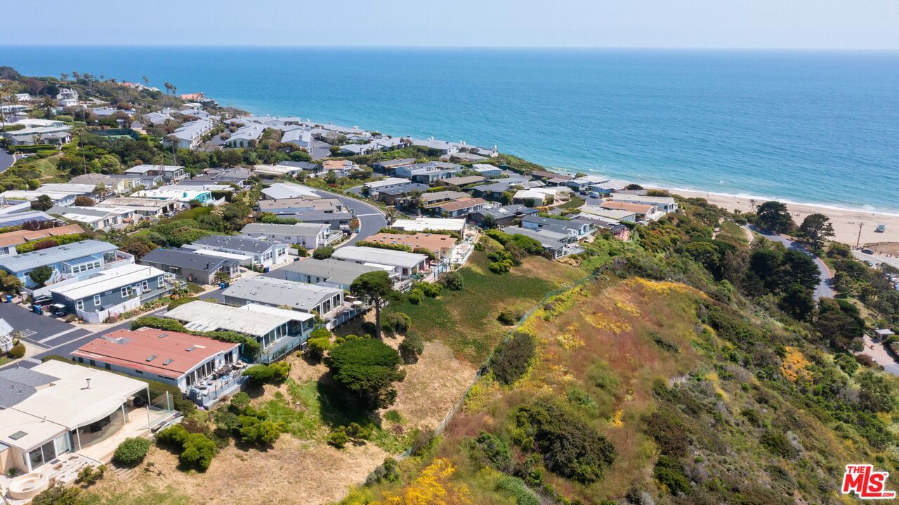 29500 Heathercliff Road, Unit 184 Malibu, CA 90265 - Photo 44 of 46 an aerial view of ocean and residential houses with outdoor space