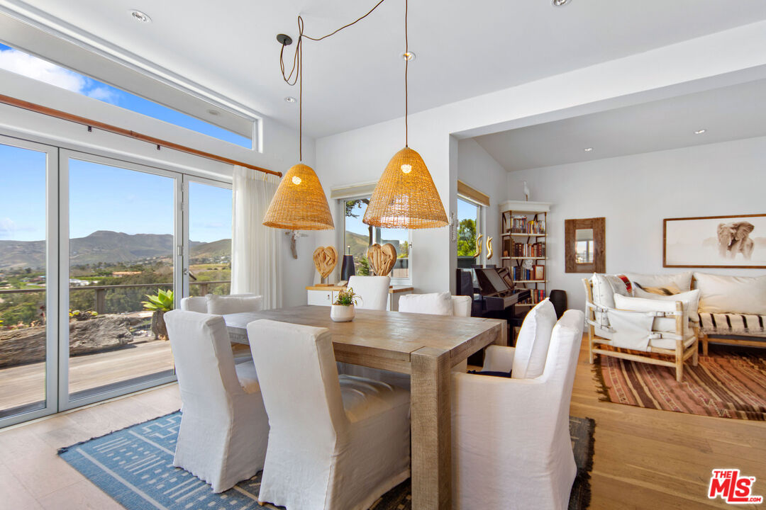 29500 Heathercliff Road, Unit 184 Malibu, CA 90265 - Photo 7 of 46 a dining room with furniture window and outside view