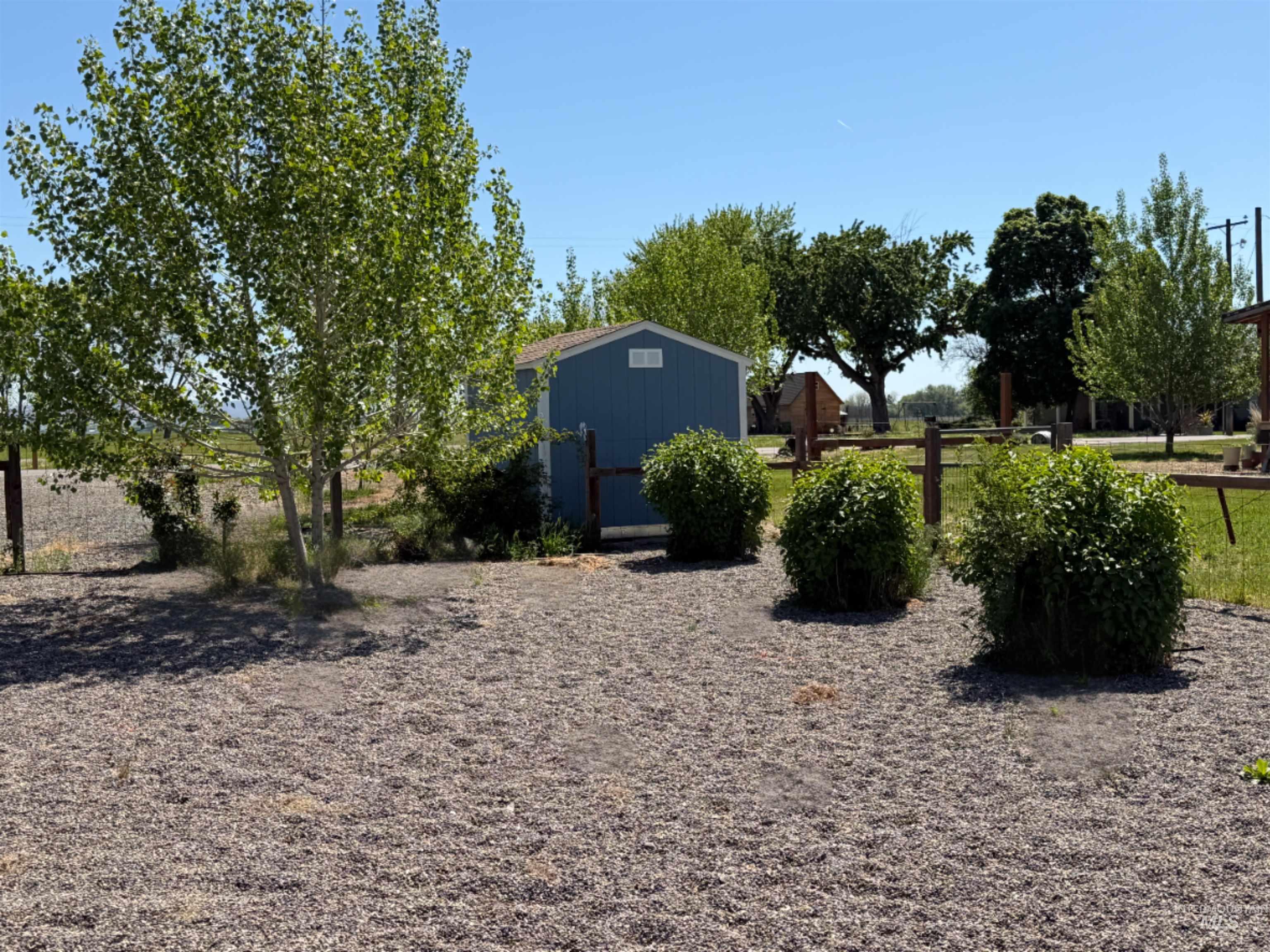 875 Eaton Road Weiser, ID 83672 - Photo 23 of 30 Expansive gravel area with mature trees and established shrubbery