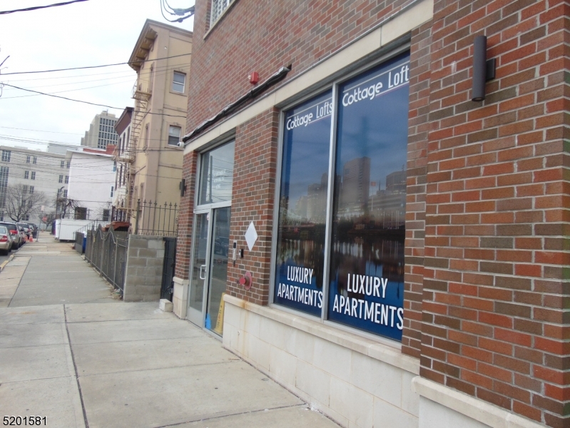 25 Cottage Street, Unit 1 Newark, NJ 07102 - Photo 2 of 9 a view of a brick building with a glass door