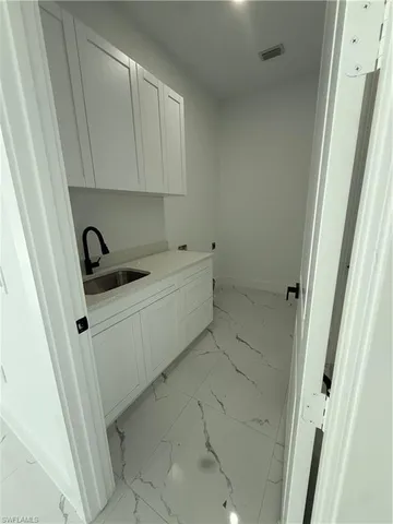 a bathroom with a sink and a window