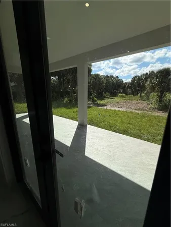 a view of a yard from a balcony