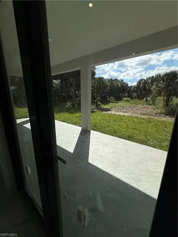 a view of a yard from a balcony