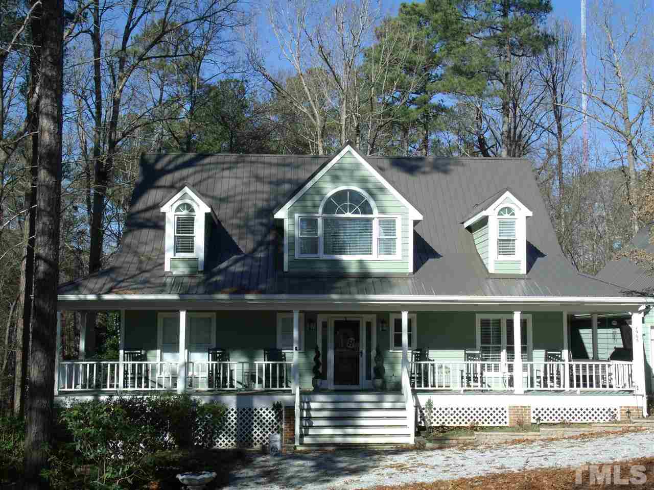 7908 Senter Farm Road Apex, NC 27539 - Photo 2 of 25 Beautiful curb appeal boast a relaxing farmers porch, and detached 2 car garage