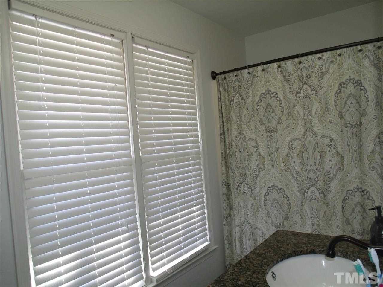 7908 Senter Farm Road Apex, NC 27539 - Photo 19 of 25 master bath offers separate dual sinks, one near shower/bath area and one in entry area