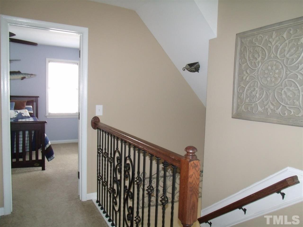 7908 Senter Farm Road Apex, NC 27539 - Photo 22 of 25 second floor boast beautiful upgraded rod iron rails