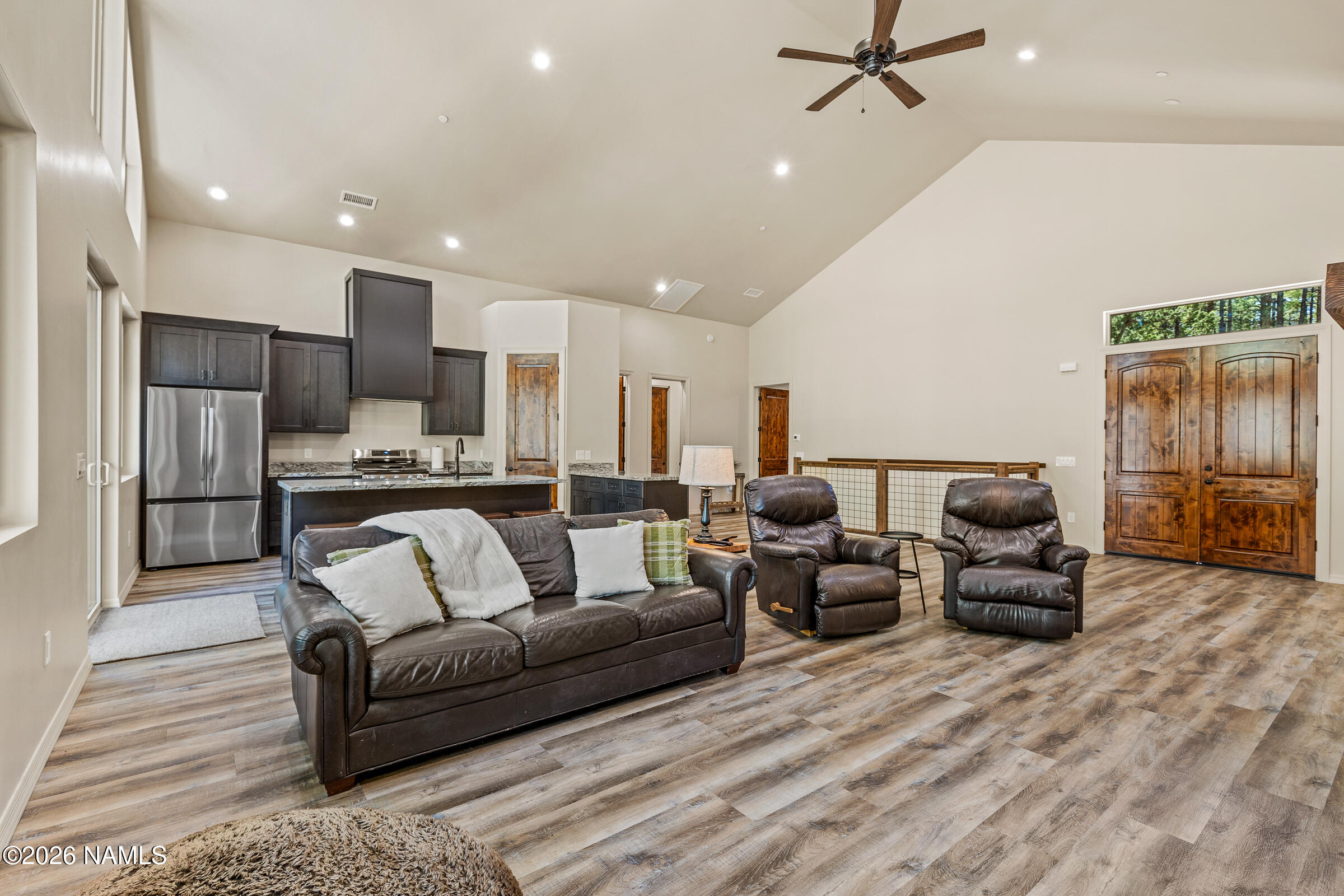 1093 Redwall Way Williams, AZ 86046 - Photo 11 of 70 a living room with furniture and kitchen view