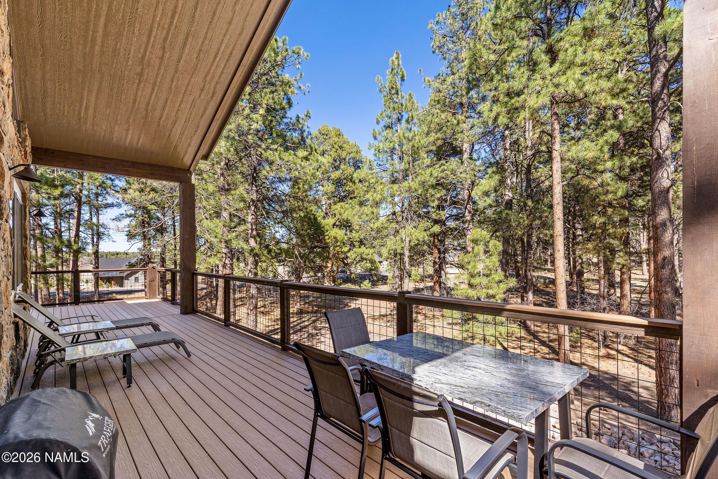 1093 Redwall Way Williams, AZ 86046 - Photo 13 of 70 a balcony with wooden floor and outdoor seating