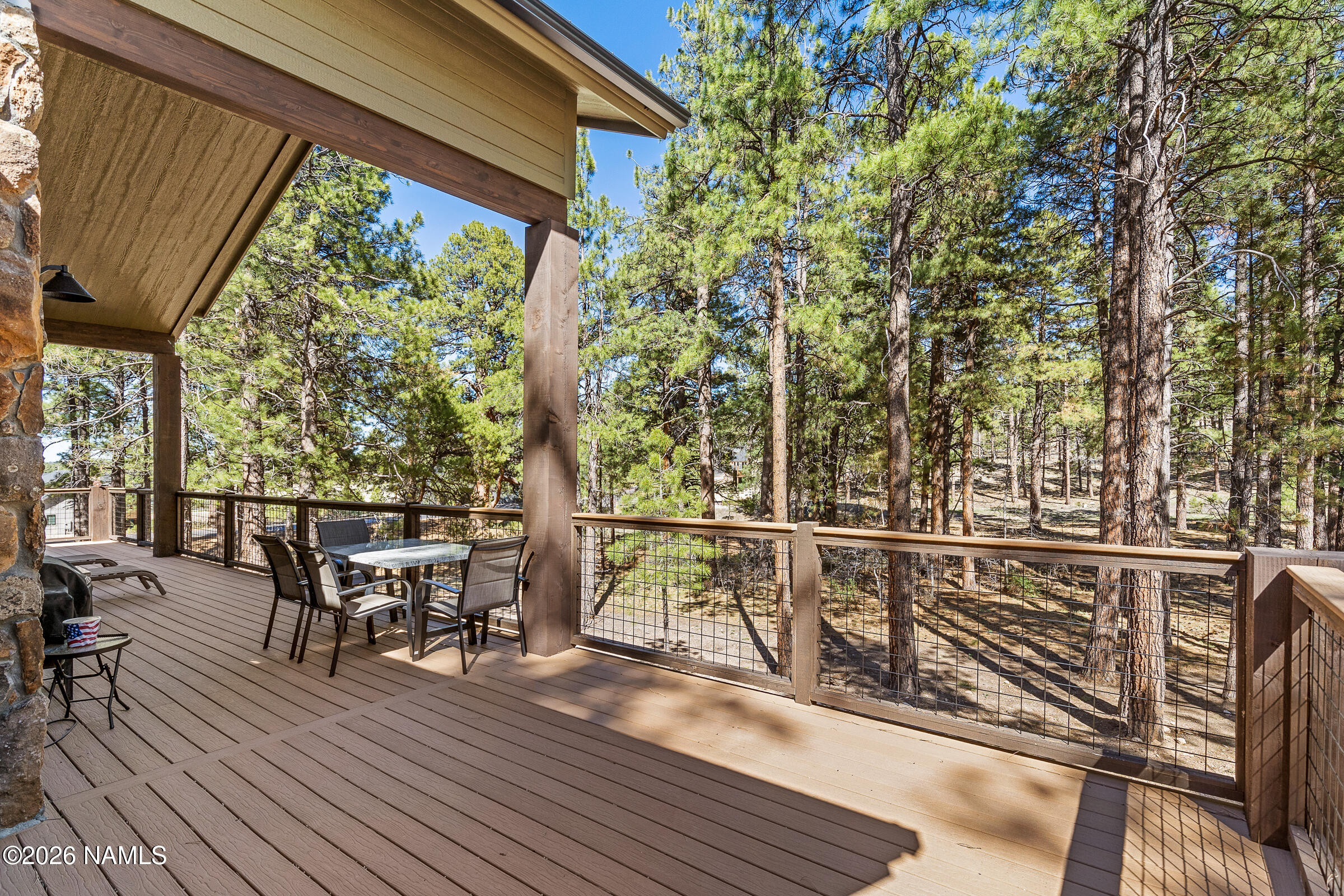 1093 Redwall Way Williams, AZ 86046 - Photo 14 of 70 a view of a chairs and table on the wooden deck