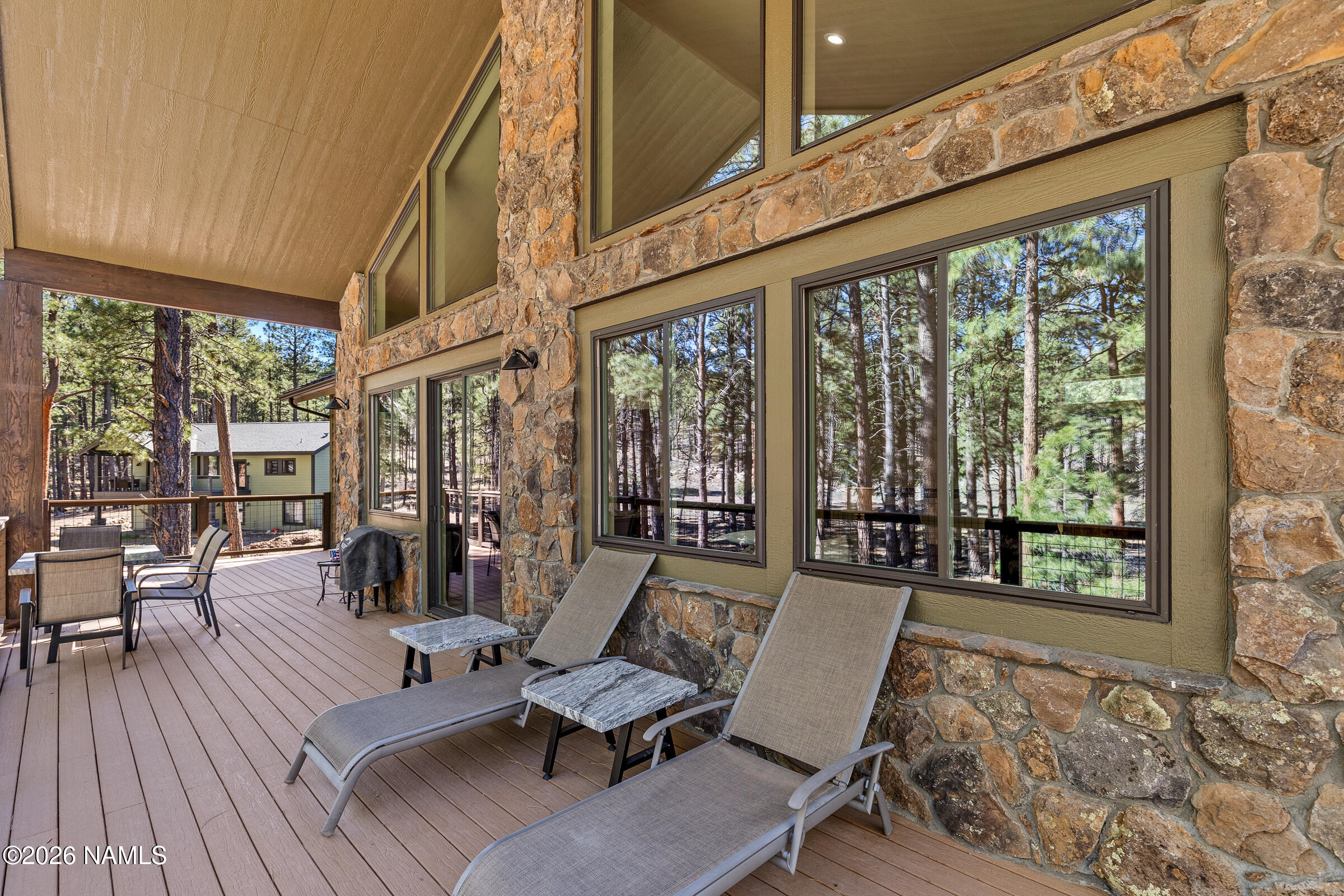 1093 Redwall Way Williams, AZ 86046 - Photo 16 of 70 a living room with furniture and floor to ceiling windows