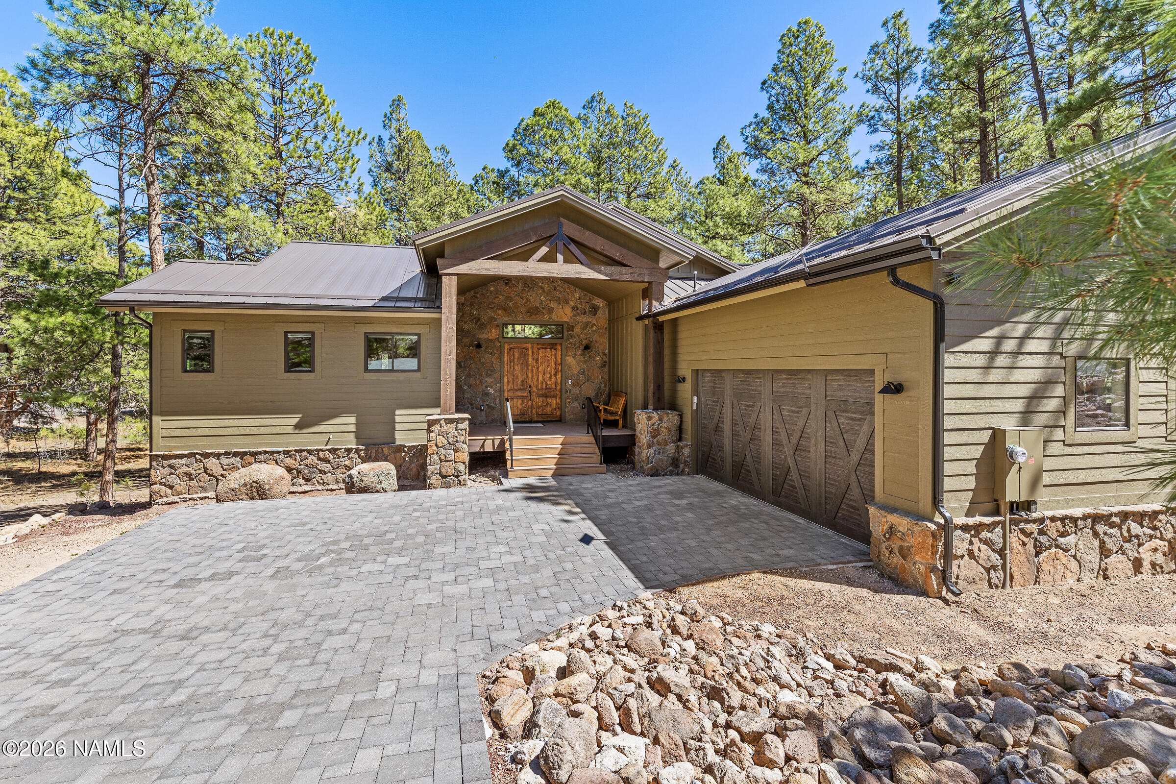 1093 Redwall Way Williams, AZ 86046 - Photo 2 of 70 a backyard of a house with large tree and wooden fence
