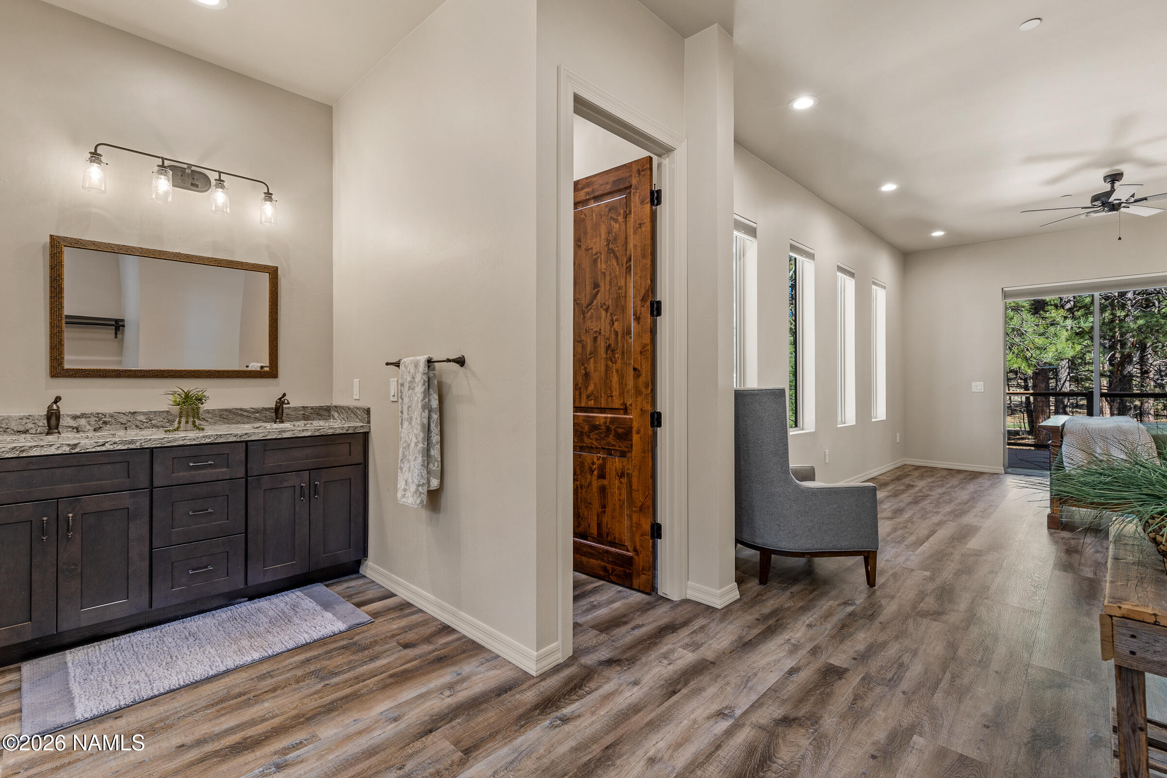1093 Redwall Way Williams, AZ 86046 - Photo 23 of 70 a spacious bathroom with a granite countertop sink mirror and bathtub