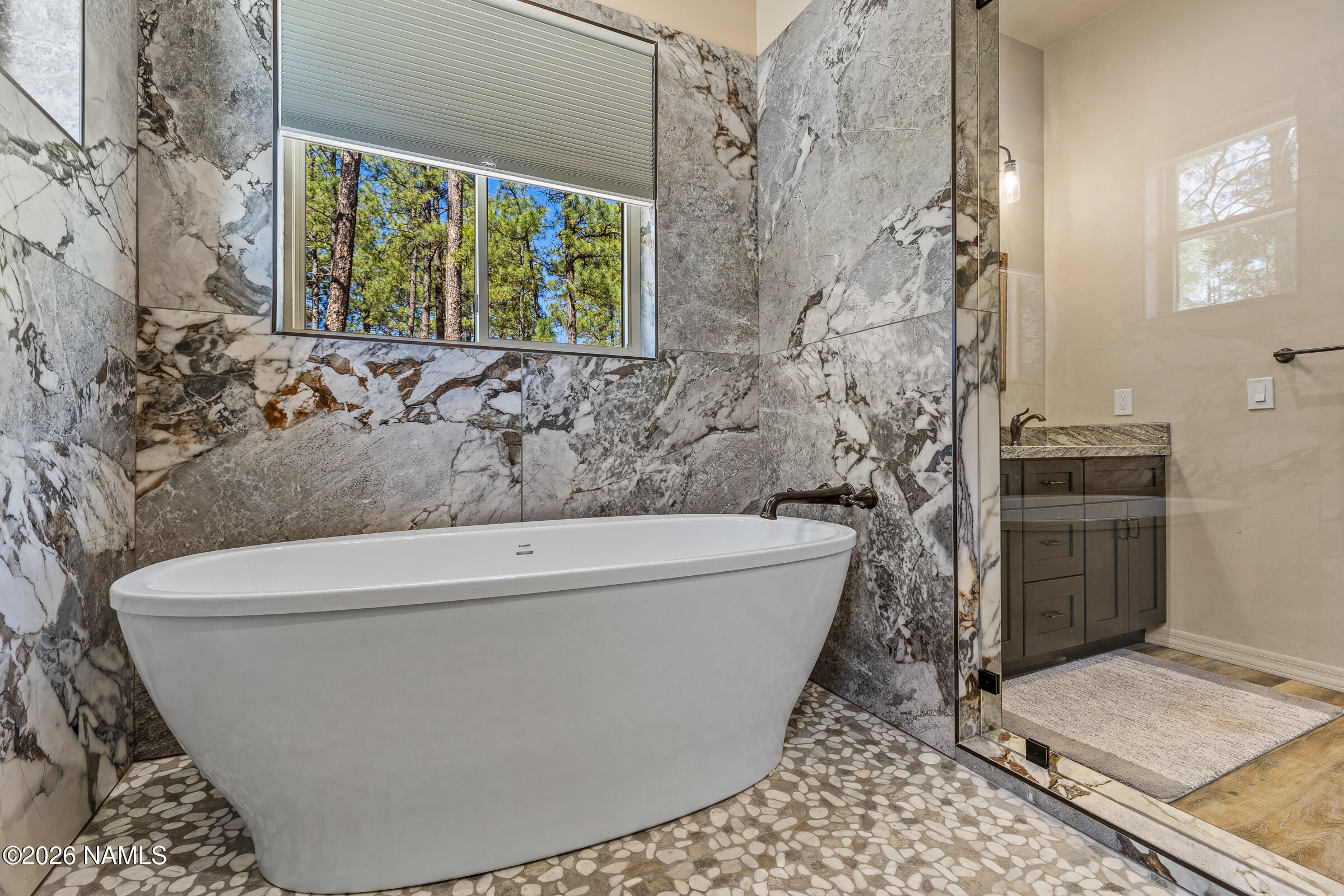 1093 Redwall Way Williams, AZ 86046 - Photo 26 of 70 a white bath tub sitting in a bathroom