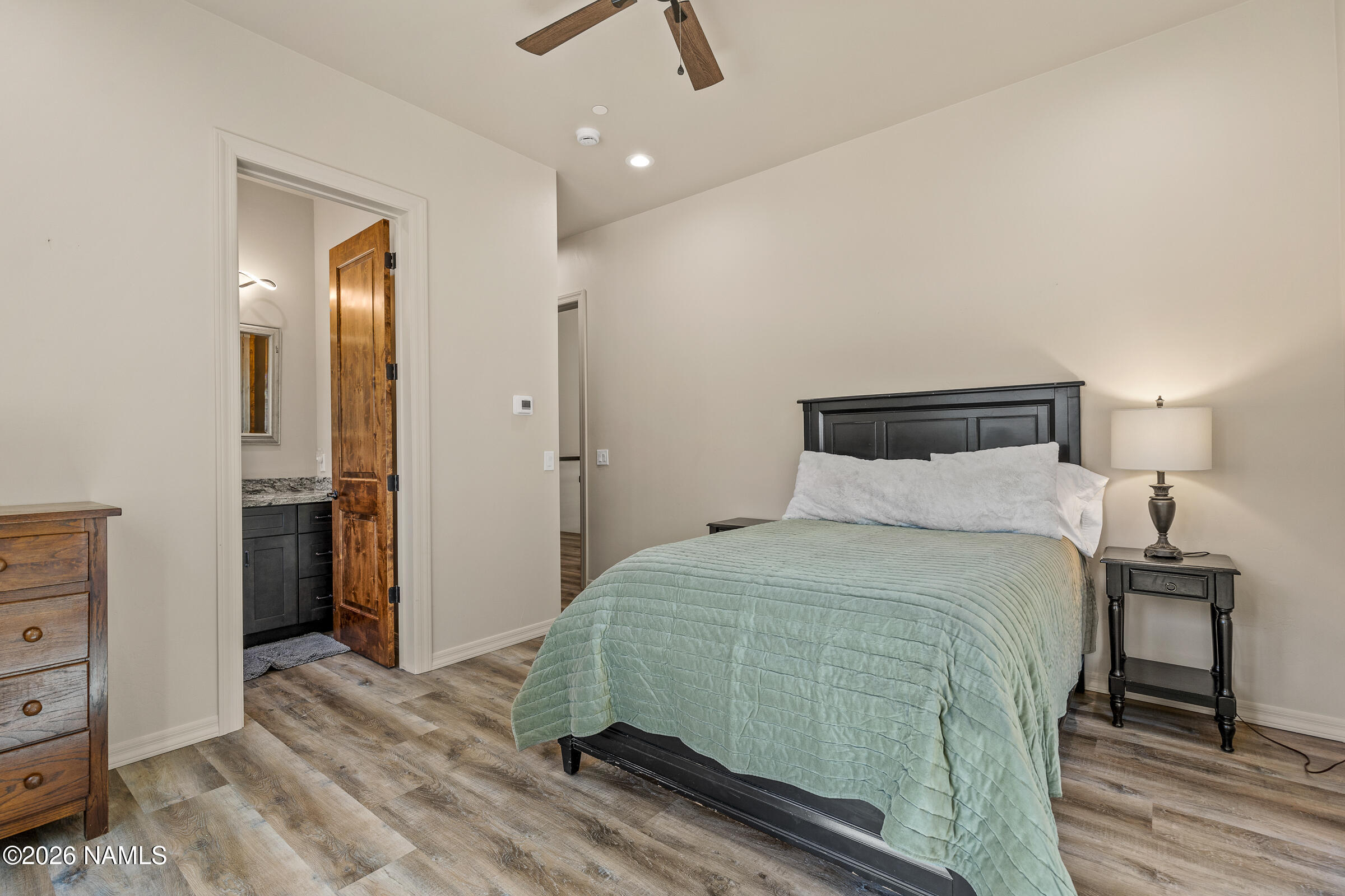 1093 Redwall Way Williams, AZ 86046 - Photo 33 of 70 a bedroom with a bed and a mirror