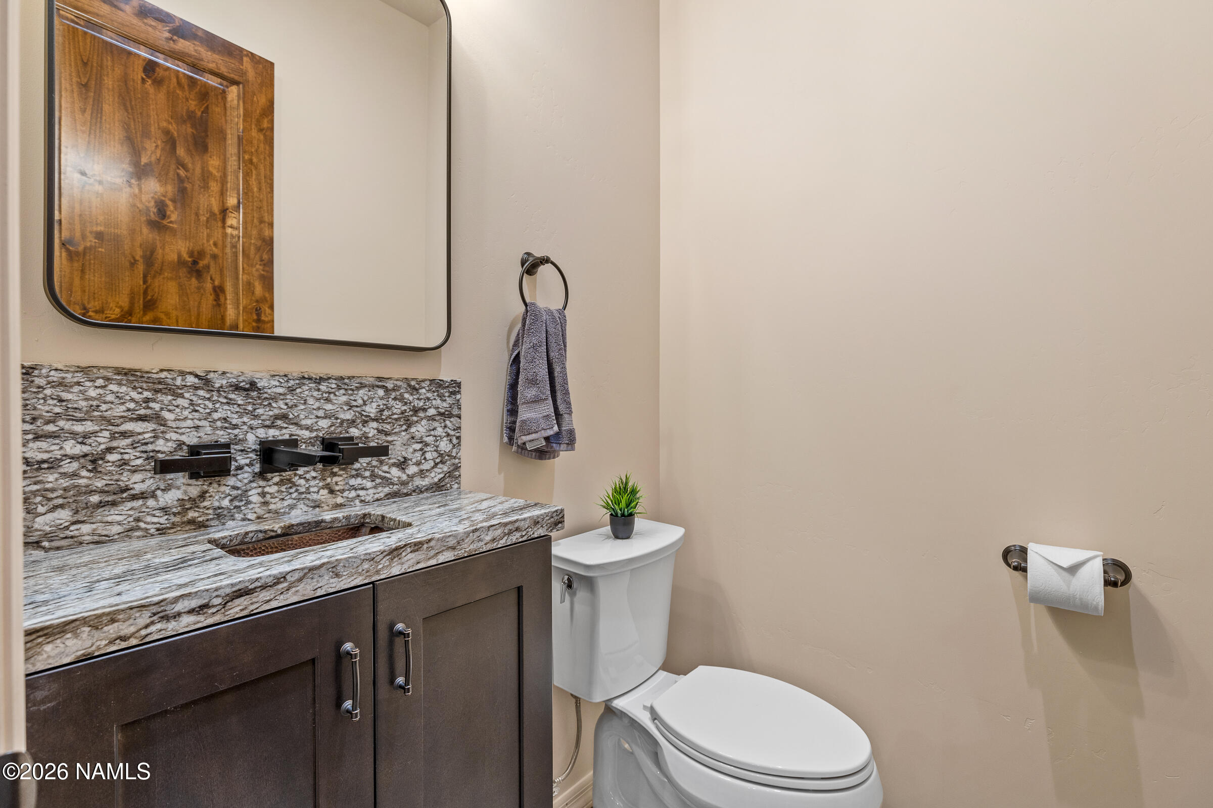 1093 Redwall Way Williams, AZ 86046 - Photo 36 of 70 a bathroom with a granite countertop toilet sink and mirror