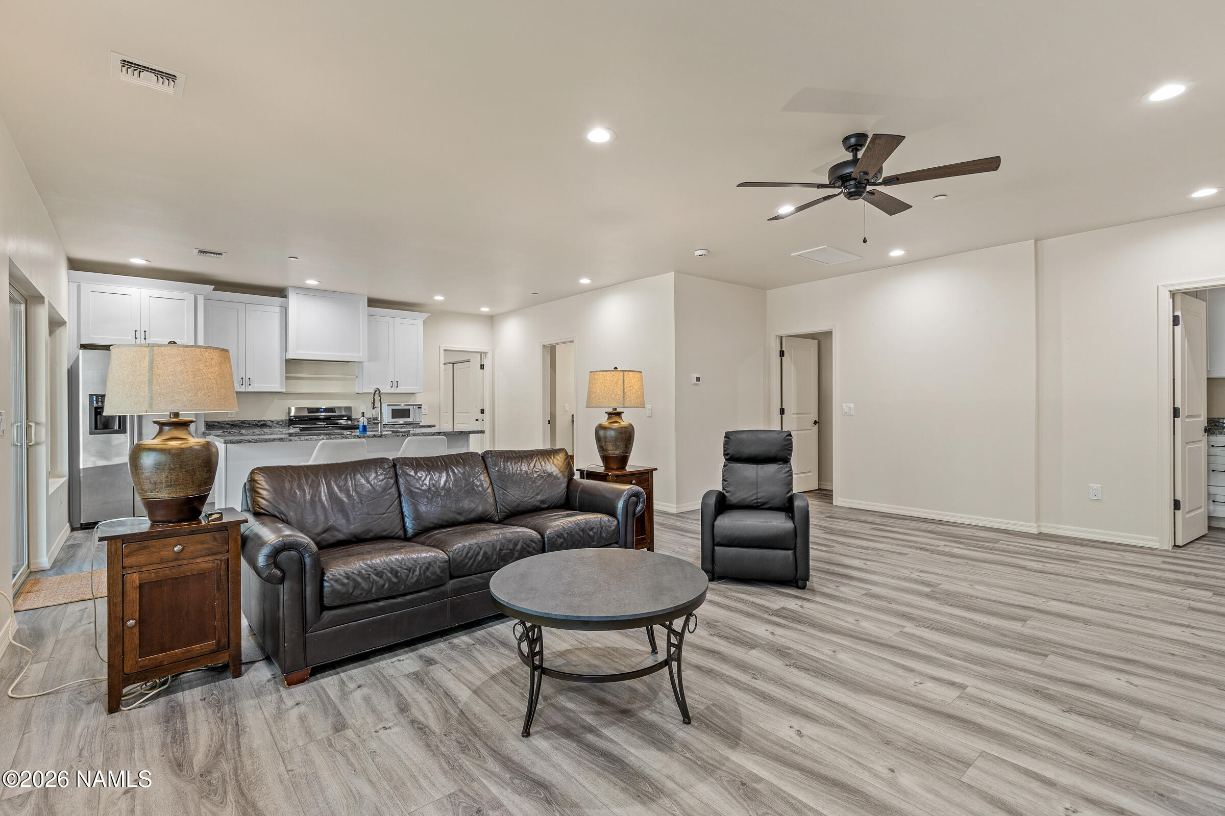 1093 Redwall Way Williams, AZ 86046 - Photo 38 of 70 a living room with furniture and a wooden floor