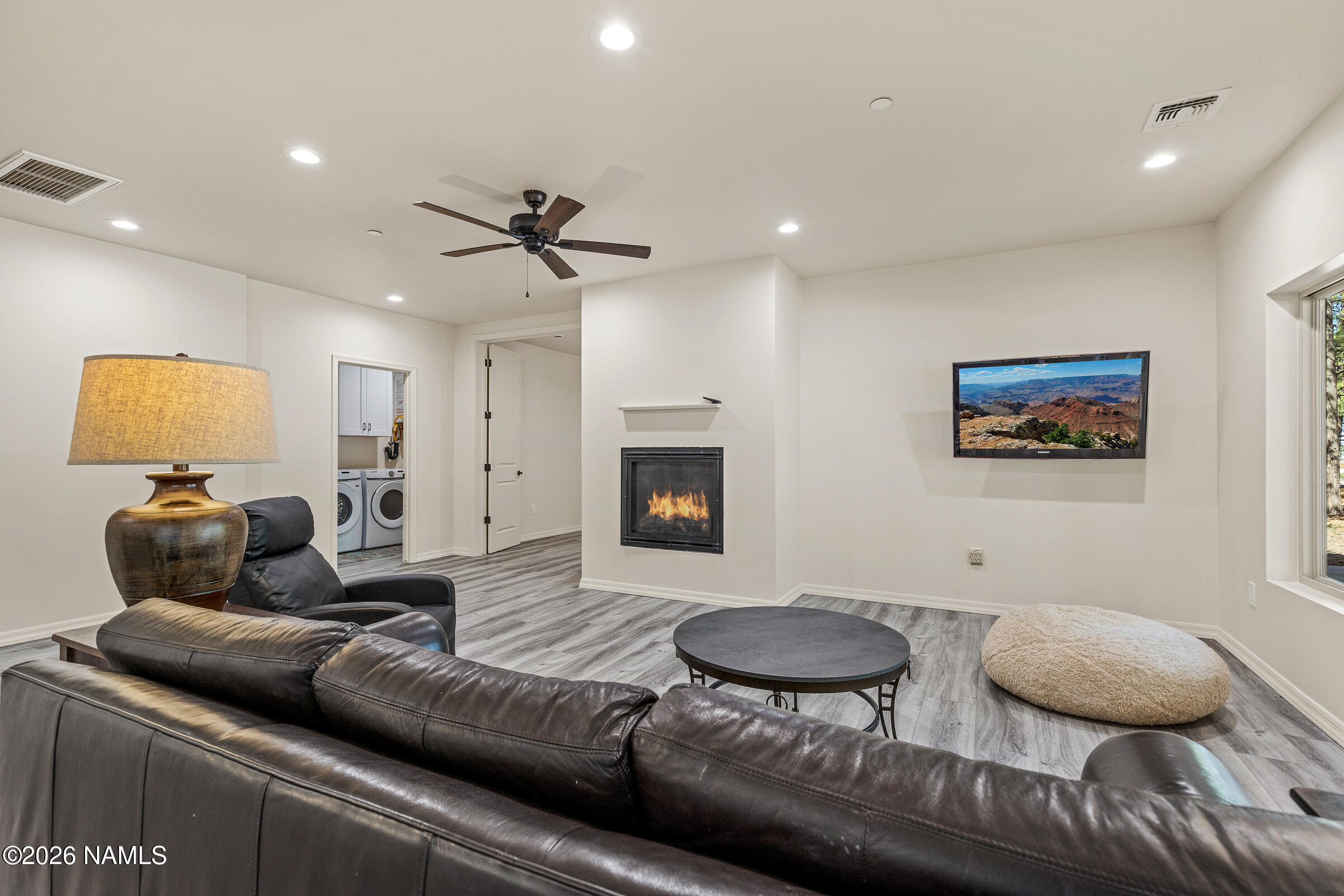 1093 Redwall Way Williams, AZ 86046 - Photo 39 of 70 a living room with furniture and a wooden floor