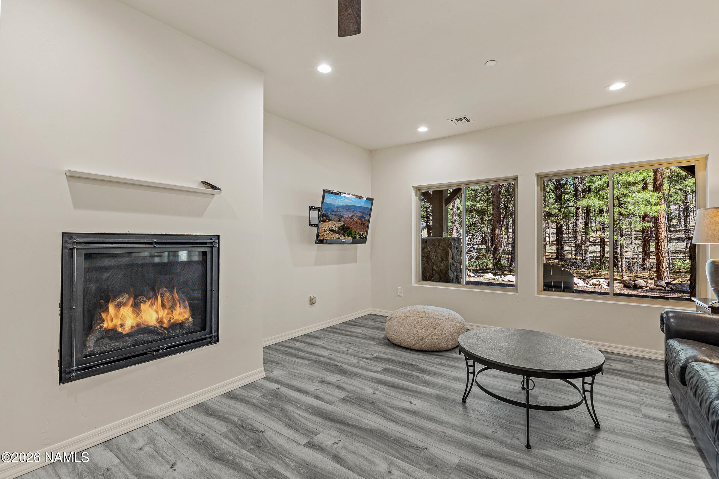 1093 Redwall Way Williams, AZ 86046 - Photo 40 of 70 a living room with furniture and a fireplace