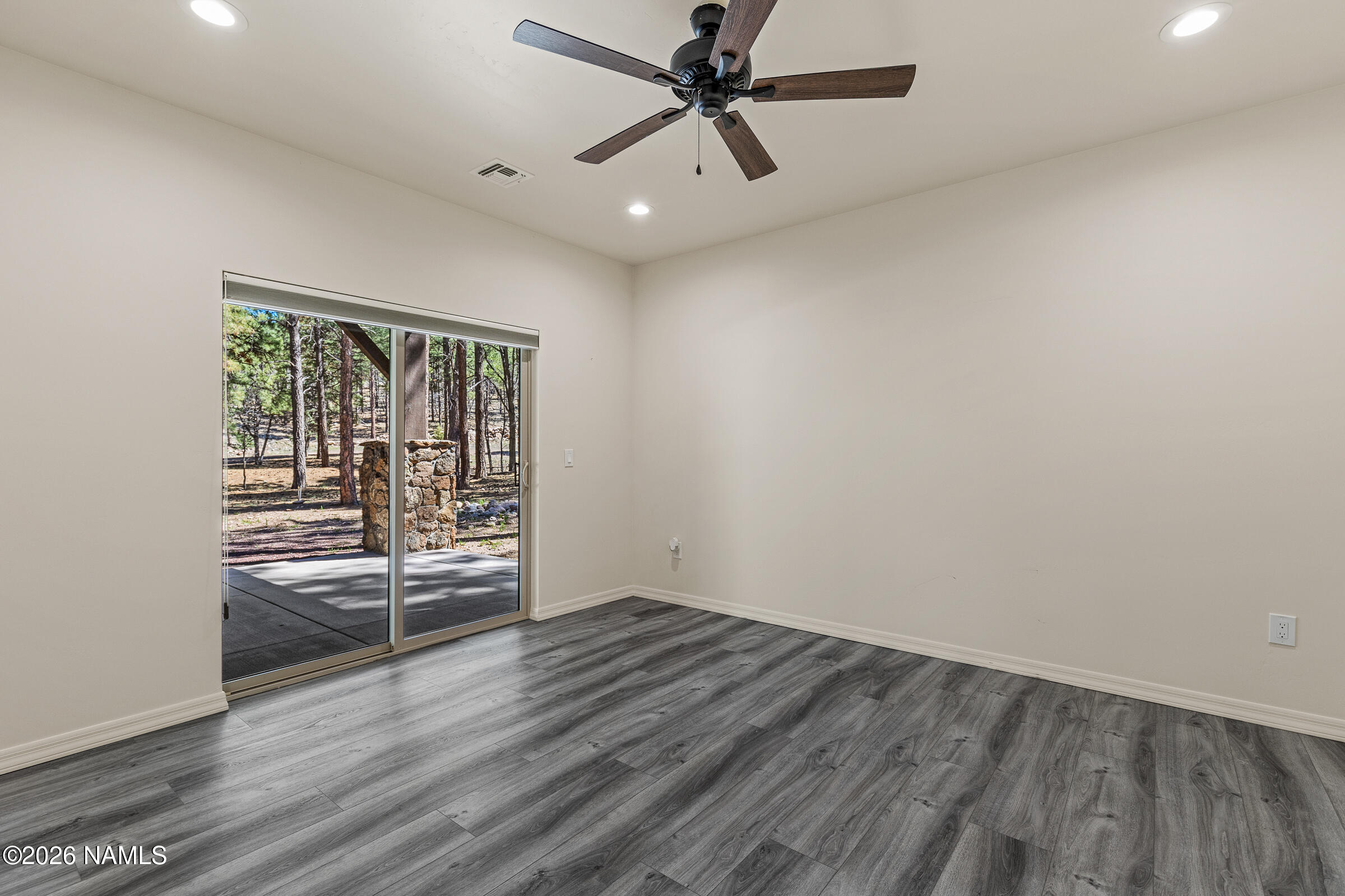 1093 Redwall Way Williams, AZ 86046 - Photo 44 of 70 wooden floor in an empty room with a window