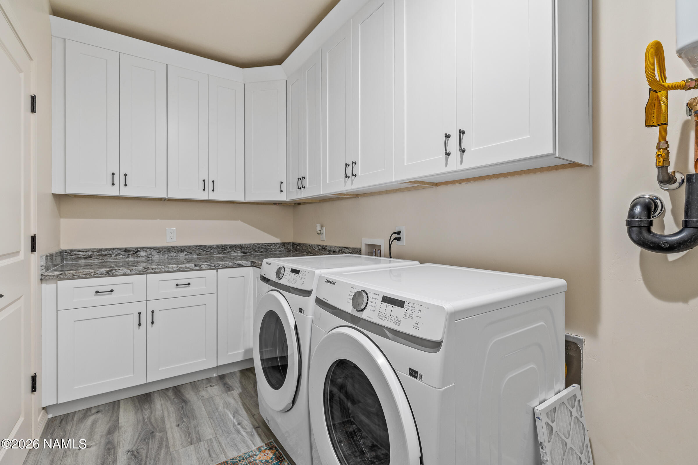 1093 Redwall Way Williams, AZ 86046 - Photo 51 of 70 a view of a storage & utility room with washer and dryer
