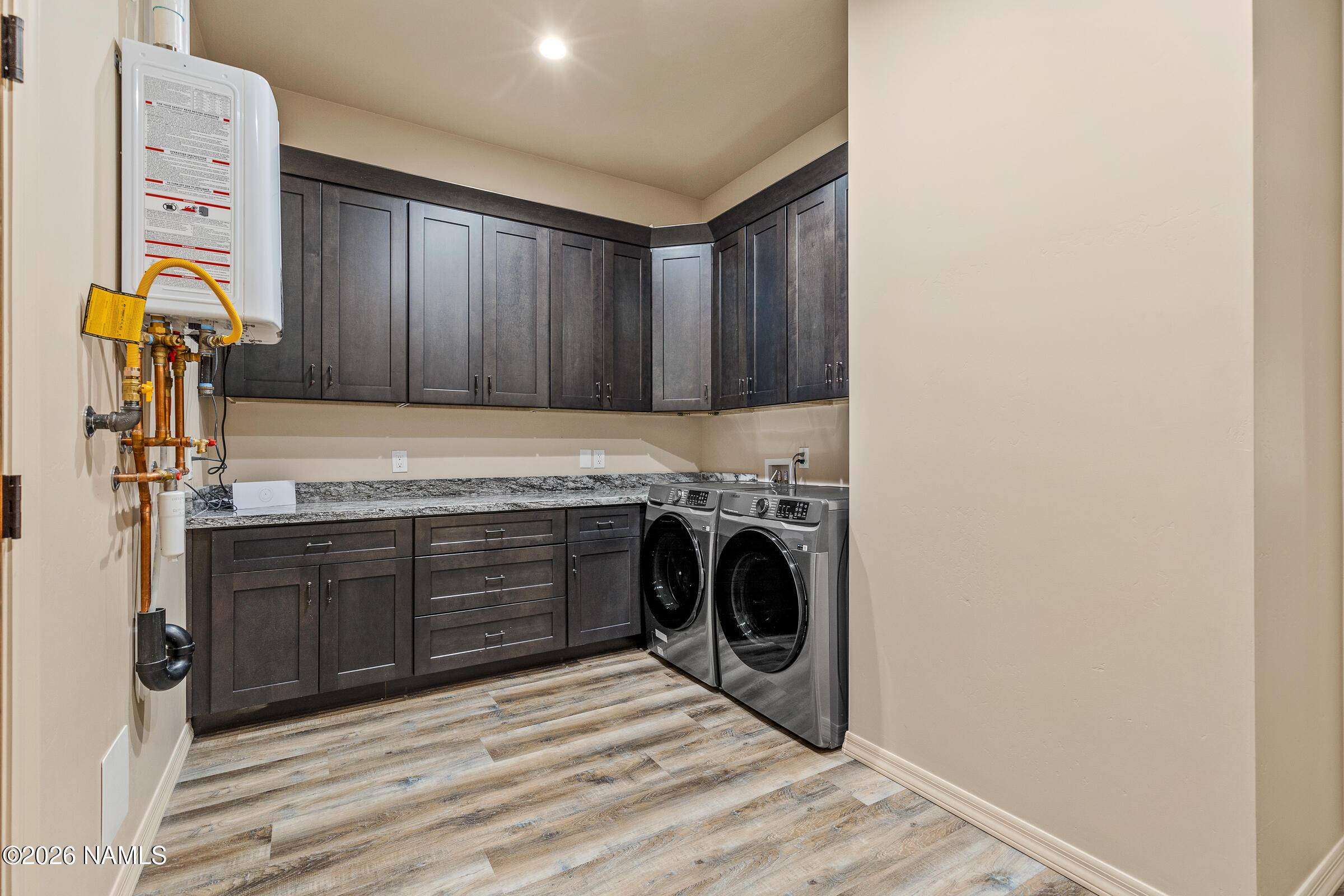 1093 Redwall Way Williams, AZ 86046 - Photo 52 of 70 a kitchen with a refrigerator and a stove top oven