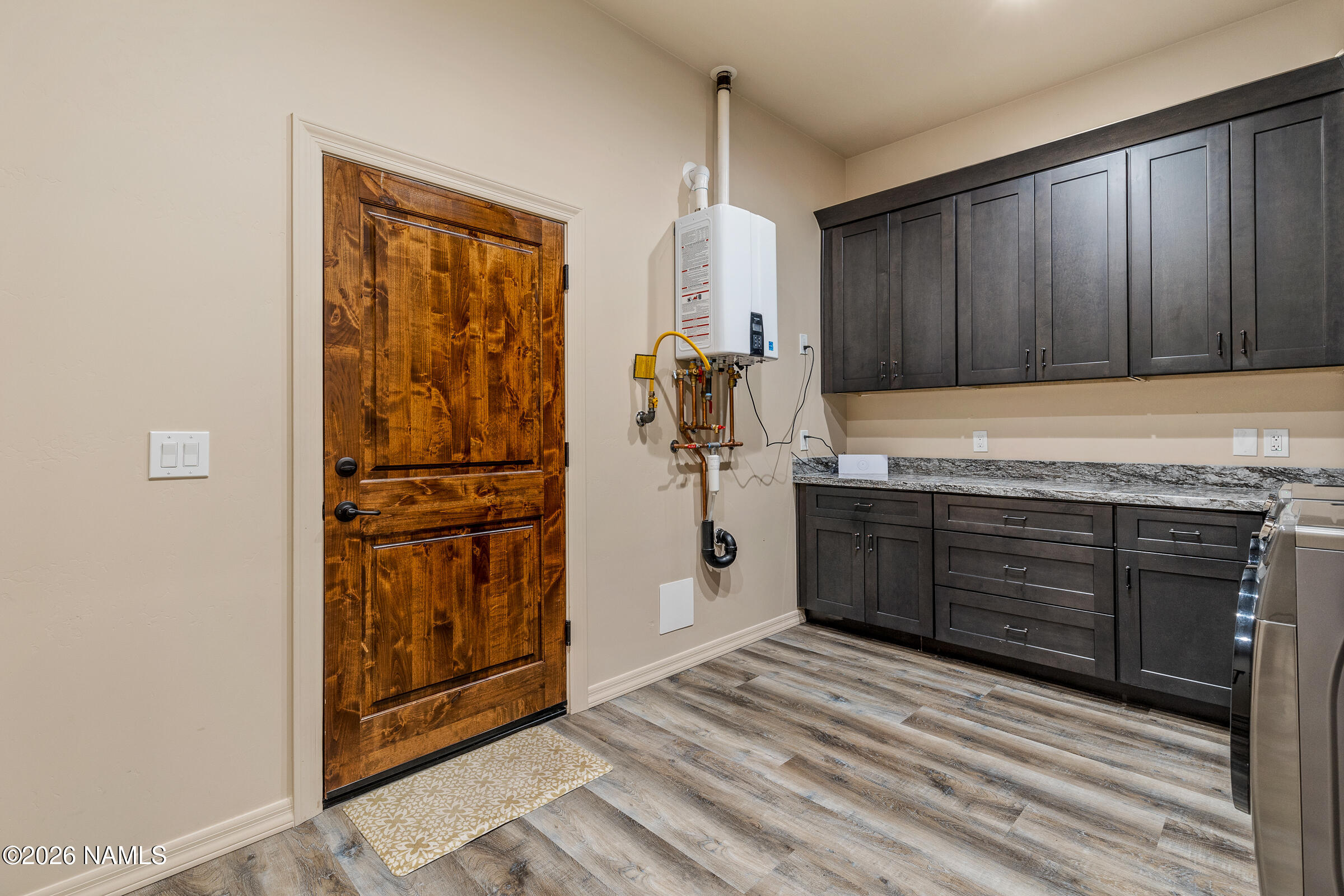 1093 Redwall Way Williams, AZ 86046 - Photo 53 of 70 a kitchen with a refrigerator and cabinets