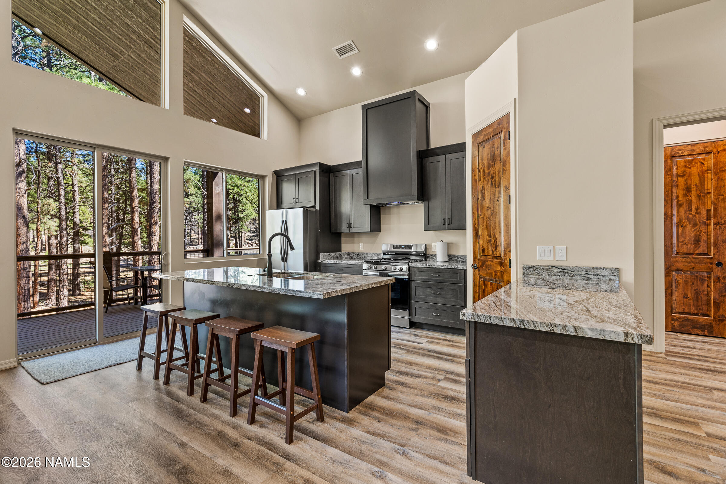 1093 Redwall Way Williams, AZ 86046 - Photo 8 of 70 a large kitchen with kitchen island a large counter top space and stainless steel appliances