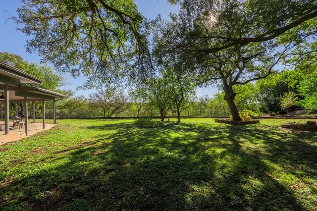 a view of outdoor space with deck and trees