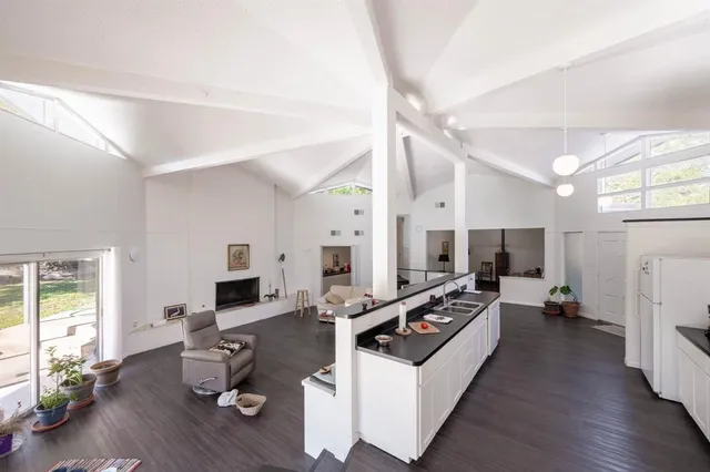 a view of living room with furniture and wooden floor