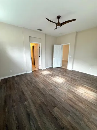 a bathroom with a double vanity sink mirror and shower