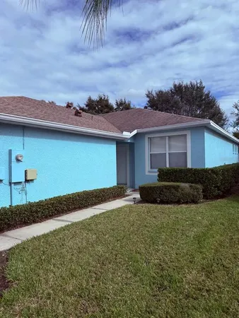 a view of a house with a yard