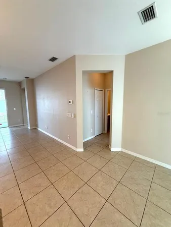 a view of an empty room and window