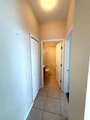 a bathroom with a glass door shower a sink and a mirror