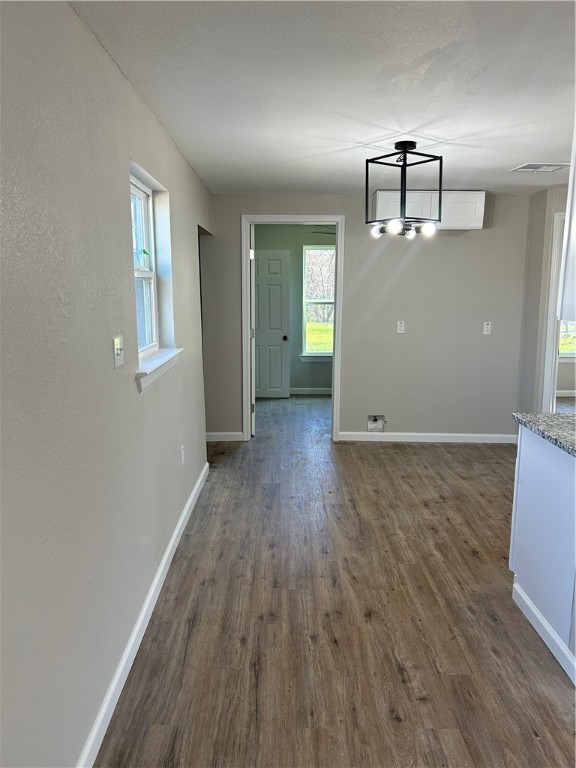 211 Stanfield Drive Waco, TX 76705 - Photo 2 of 8 an empty room with wooden floor and windows