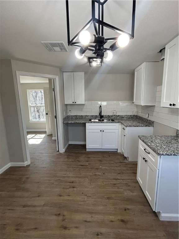 211 Stanfield Drive Waco, TX 76705 - Photo 4 of 8 a kitchen with stainless steel appliances granite countertop a sink cabinets a stove and a refrigerator