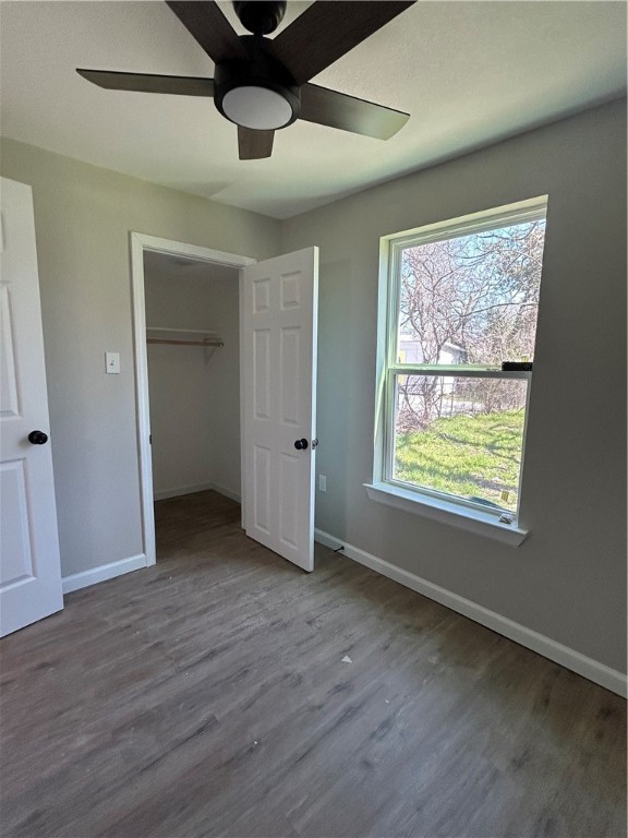211 Stanfield Drive Waco, TX 76705 - Photo 6 of 8 an empty room with wooden floor and windows