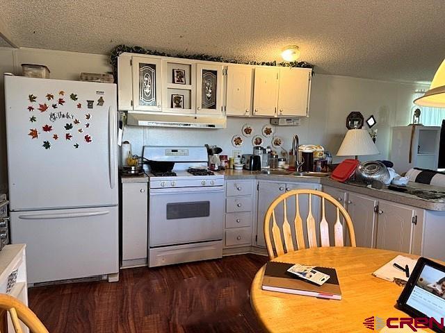 11290 Highway 145 Cortez, CO 81321 - Photo 14 of 27 a kitchen with stainless steel appliances a stove a sink and a refrigerator