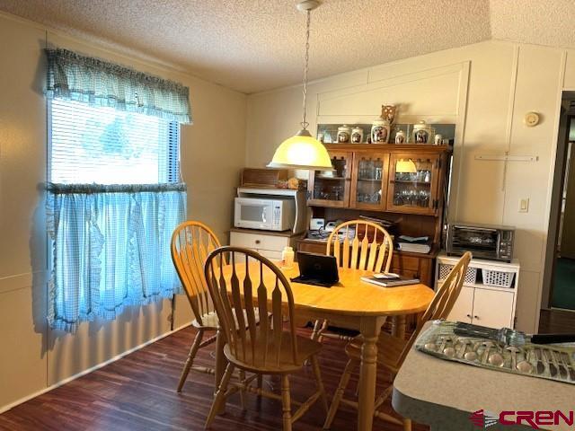 11290 Highway 145 Cortez, CO 81321 - Photo 17 of 27 a view of a dining room with furniture window and wooden floor