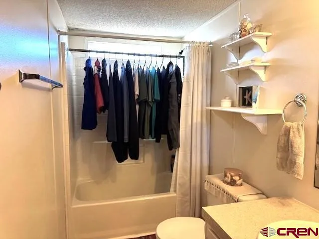 a room with furniture a window and a lamp