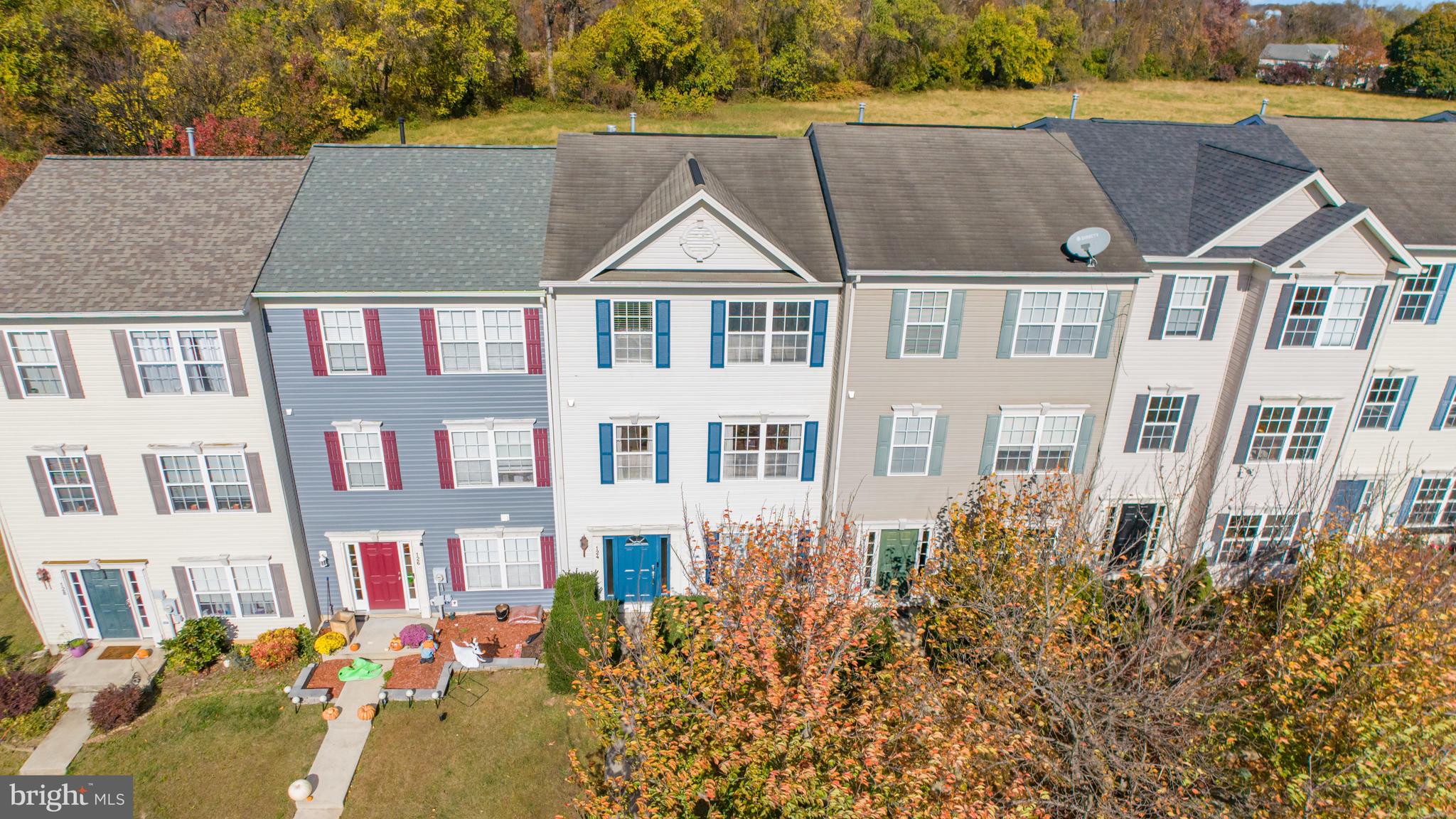 a aerial view of a residential apartment building with a yard