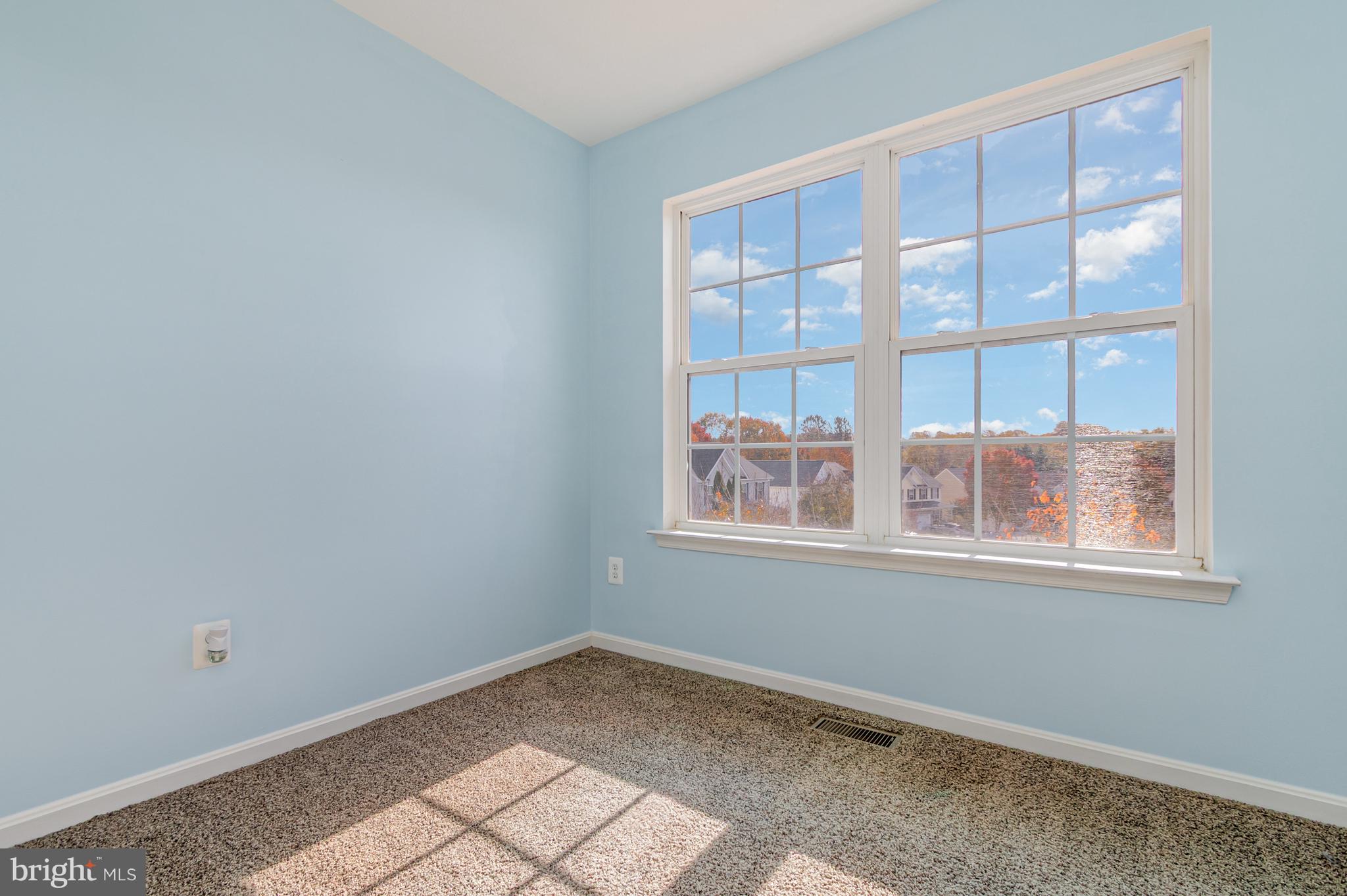 124 Maple Leaf Drive Rising Sun, MD 21911 - Photo 14 of 46 a view of empty room with windows