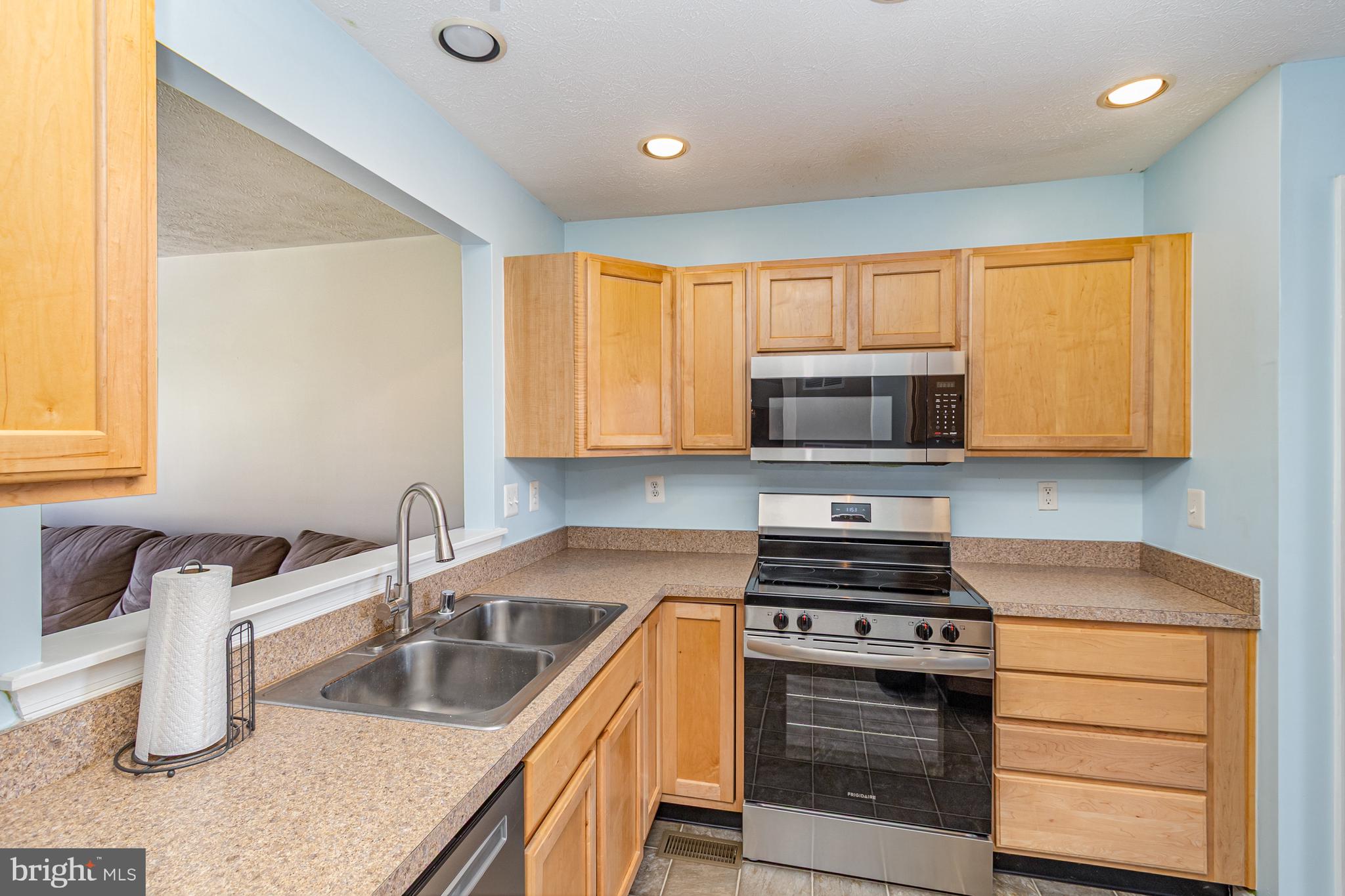 124 Maple Leaf Drive Rising Sun, MD 21911 - Photo 20 of 46 a kitchen with a sink stove and microwave