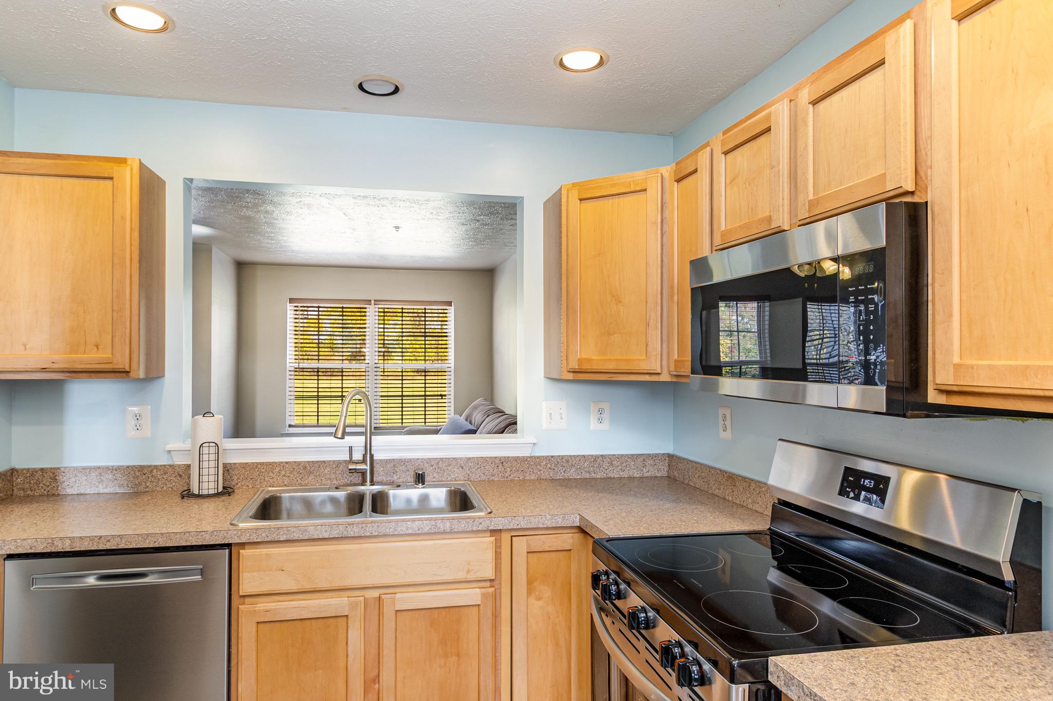 124 Maple Leaf Drive Rising Sun, MD 21911 - Photo 21 of 46 a kitchen with a sink stove top oven and cabinets