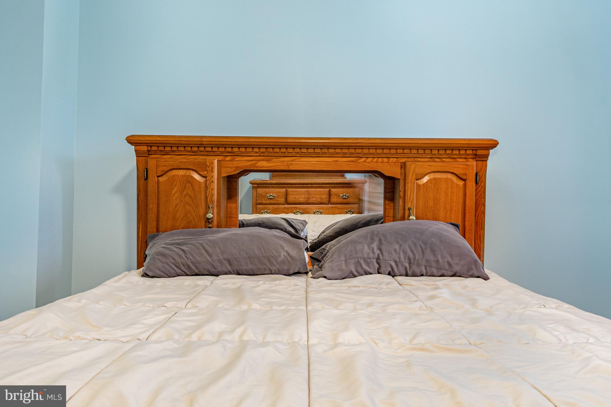 124 Maple Leaf Drive Rising Sun, MD 21911 - Photo 24 of 46 a bedroom with a bed and dresser