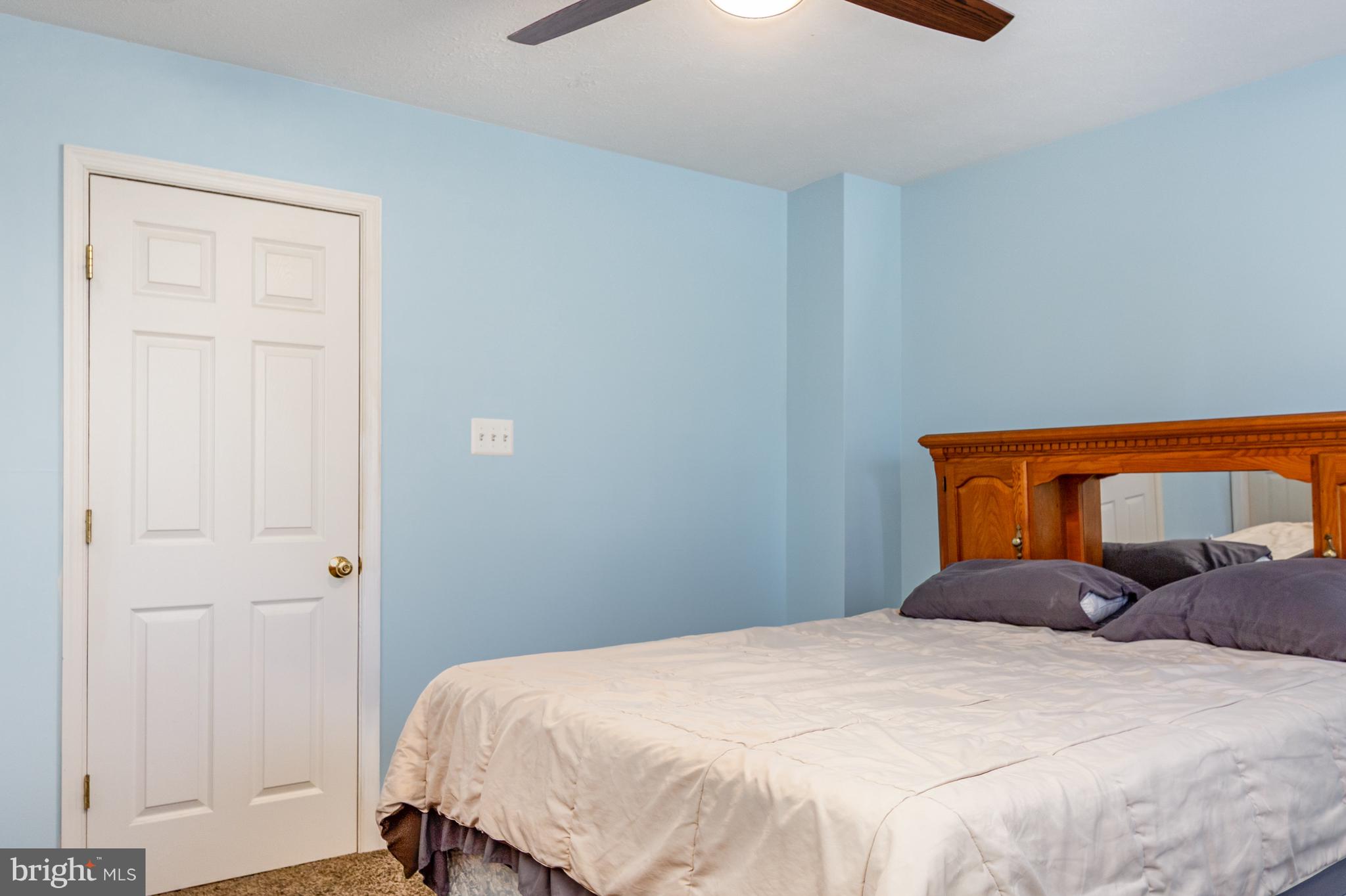 124 Maple Leaf Drive Rising Sun, MD 21911 - Photo 26 of 46 a bedroom with a bed and a dresser