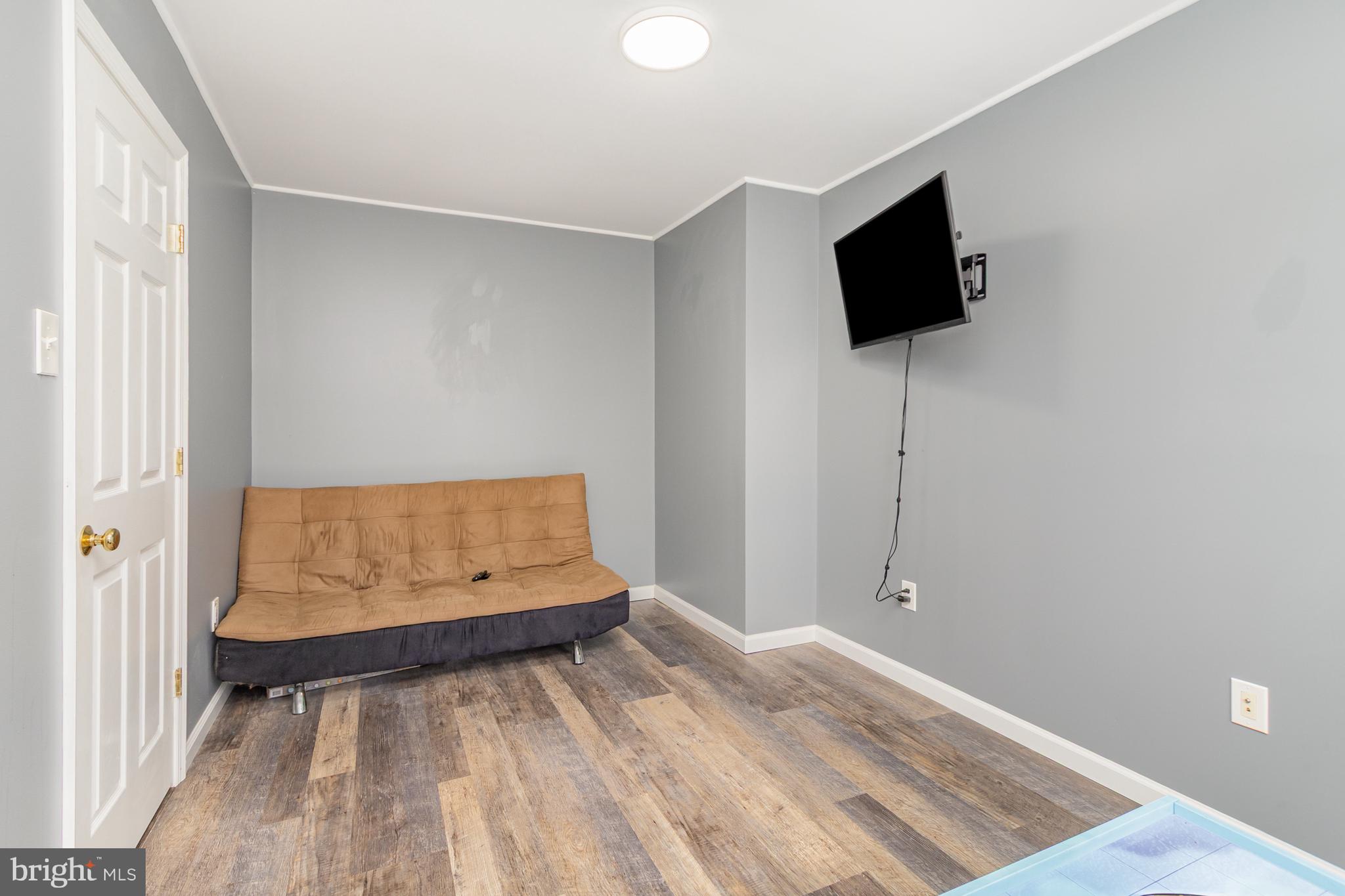 124 Maple Leaf Drive Rising Sun, MD 21911 - Photo 28 of 46 a view of room with wooden floor and flat screen tv