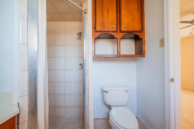 a view of a house with swimming pool and sitting area