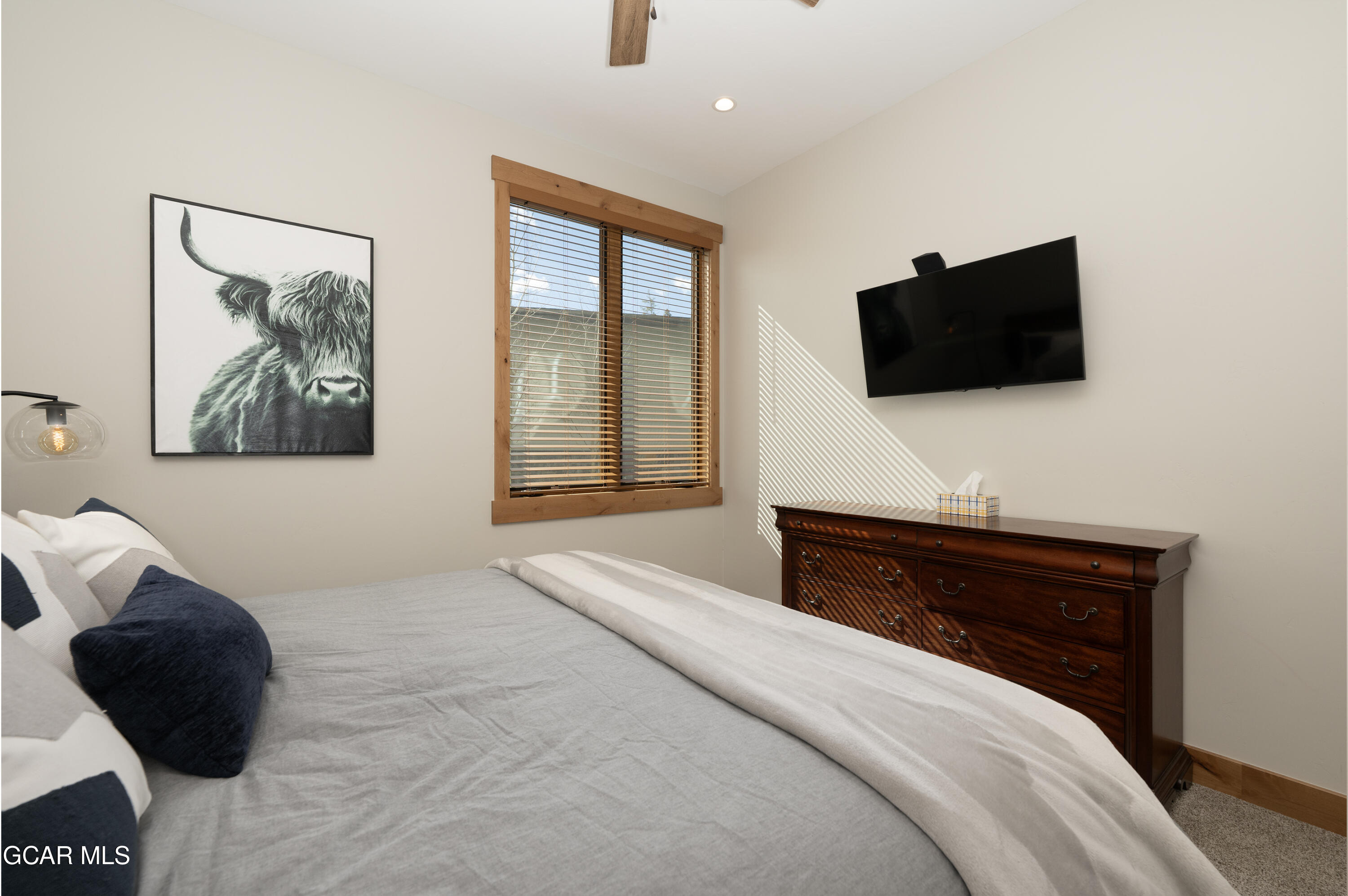 16 Springview Lane Fraser, CO 80442 - Photo 23 of 36 a bedroom with a bed and a flat screen tv