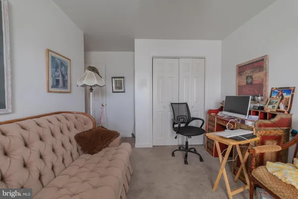 a bedroom with a workspace